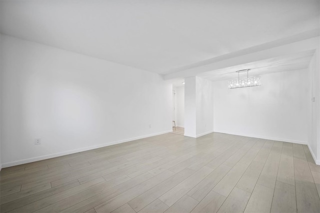 unfurnished room with light hardwood / wood-style floors