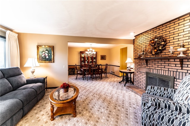 carpeted living room with a brick fireplace and a chandelier