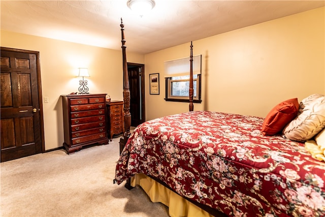 bedroom featuring light carpet