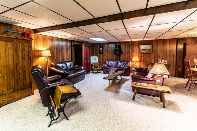 living room featuring carpet floors and wood walls