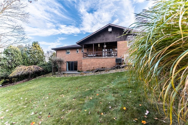 rear view of house with a lawn