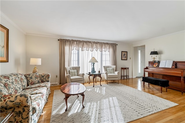 living room featuring crown molding and light hardwood / wood-style flooring