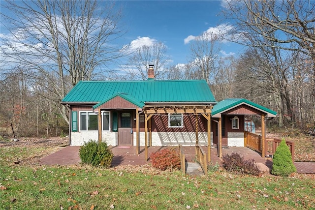 356 Stewarton Rd, Springfield Twp Fay, PA 15465 - view of front facade with a chimney and a metal roof
