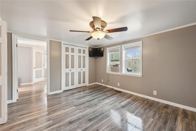 356 Stewarton Rd, Springfield Twp Fay, PA 15465 - unfurnished bedroom featuring wood finished floors, a closet, ceiling fan, crown molding, and cooling unit