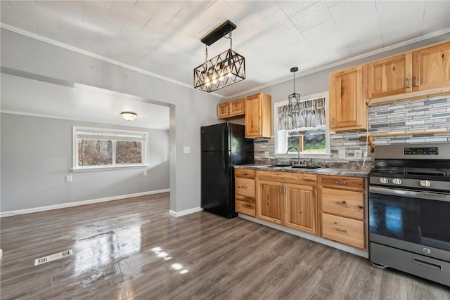 356 Stewarton Rd, Springfield Twp Fay, PA 15465 - kitchen with gas stove, freestanding refrigerator, healthy amount of natural light, backsplash, and crown molding