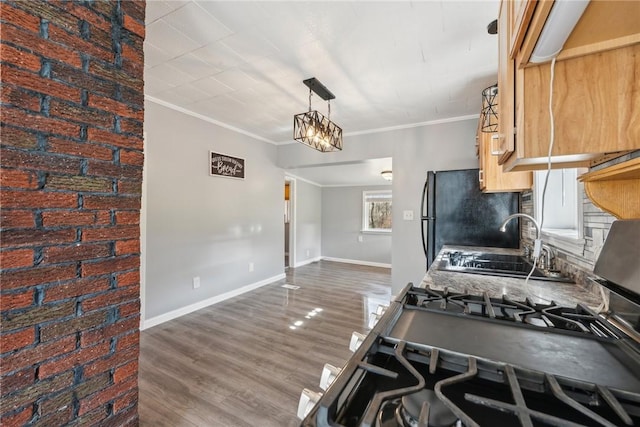356 Stewarton Rd, Springfield Twp Fay, PA 15465 - kitchen featuring dark wood-type flooring, ornamental molding, freestanding refrigerator, pendant lighting, and light brown cabinets