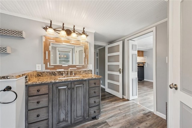 356 Stewarton Rd, Springfield Twp Fay, PA 15465 - bathroom featuring wood finished floors, vanity, and crown molding