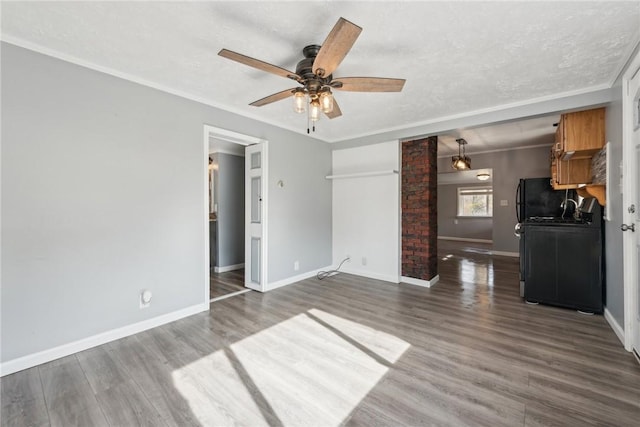 356 Stewarton Rd, Springfield Twp Fay, PA 15465 - unfurnished living room with a ceiling fan, wood finished floors, a textured ceiling, and crown molding