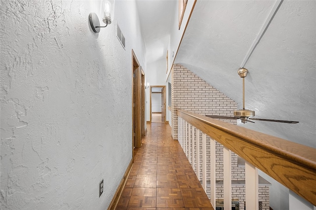 hall featuring dark parquet flooring