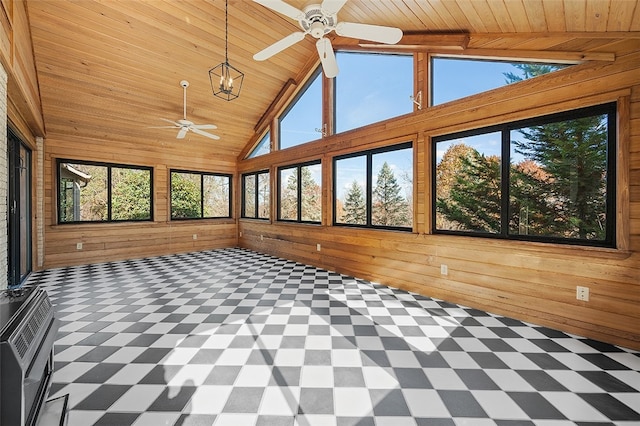 unfurnished sunroom featuring wood ceiling, heating unit, and lofted ceiling