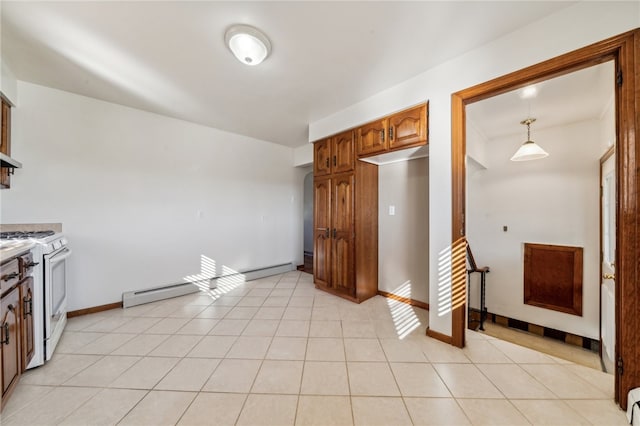 kitchen featuring gas range gas stove, light tile patterned floors, and pendant lighting