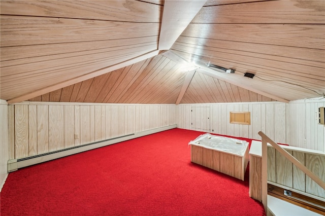 additional living space featuring wood walls and a baseboard radiator