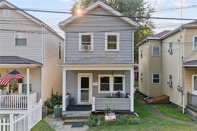 view of front of house featuring central AC unit and cooling unit