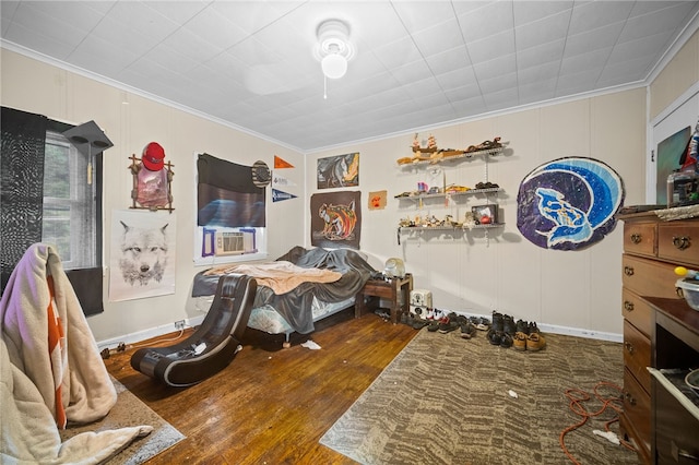 bedroom with wood-type flooring, cooling unit, and crown molding