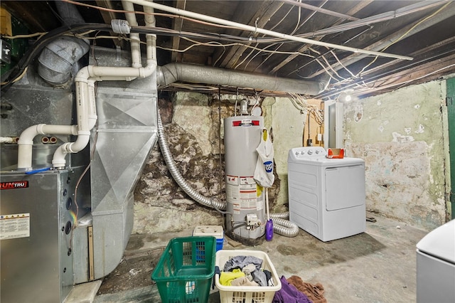 utility room with water heater, heating unit, and washer and clothes dryer