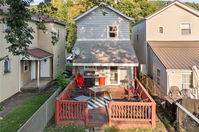 back of house featuring a deck