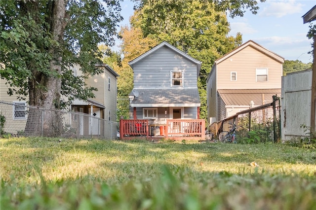 back of property featuring a wooden deck