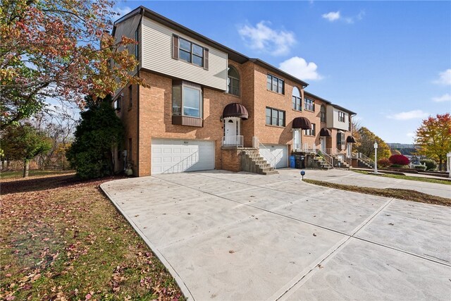 townhome / multi-family property featuring a garage