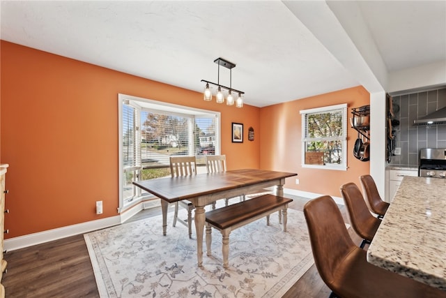 dining area with dark wood-type flooring