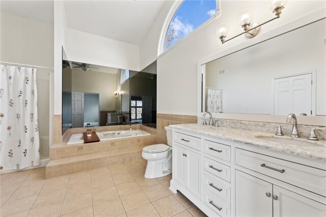 full bathroom featuring toilet, tile patterned flooring, plus walk in shower, vanity, and ceiling fan