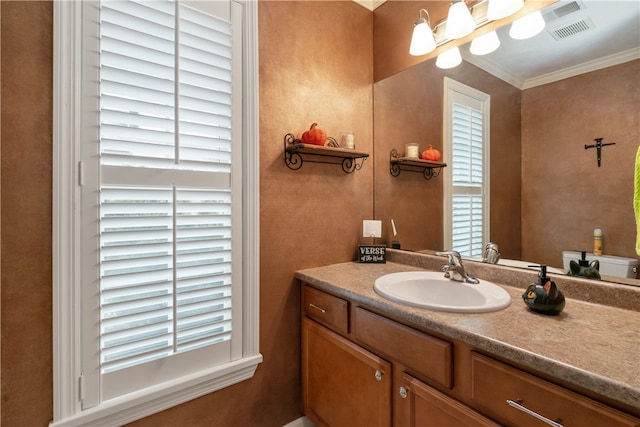 bathroom featuring toilet, vanity, and ornamental molding