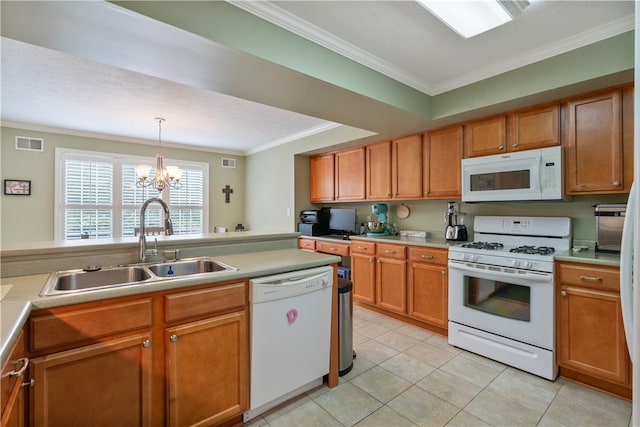 kitchen featuring sink, decorative light fixtures, white appliances, crown molding, and a notable chandelier