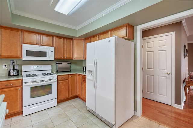 kitchen featuring white appliances, light wood-type flooring, and ornamental molding