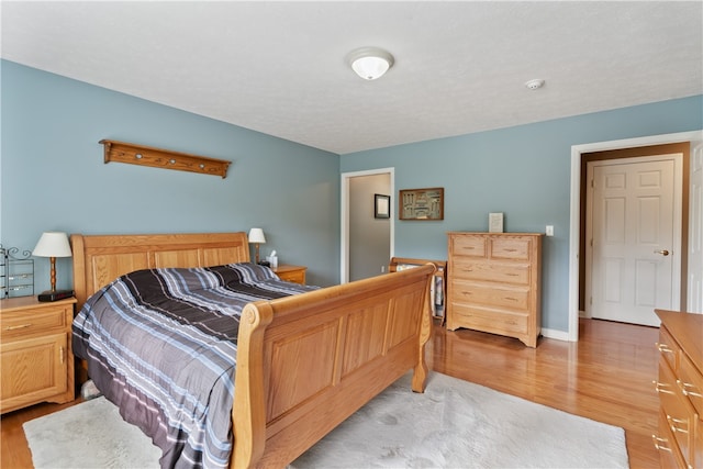 bedroom featuring light wood-type flooring