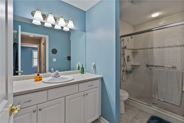 bathroom with toilet, tile patterned flooring, a textured ceiling, vanity, and a shower with shower door