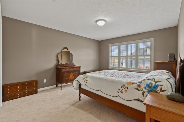 carpeted bedroom with a textured ceiling