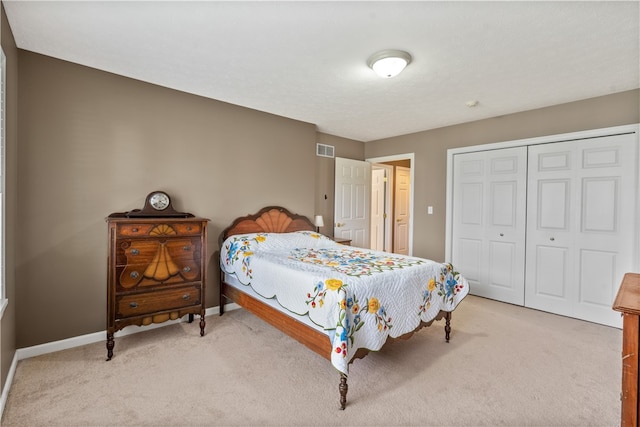 carpeted bedroom with a closet