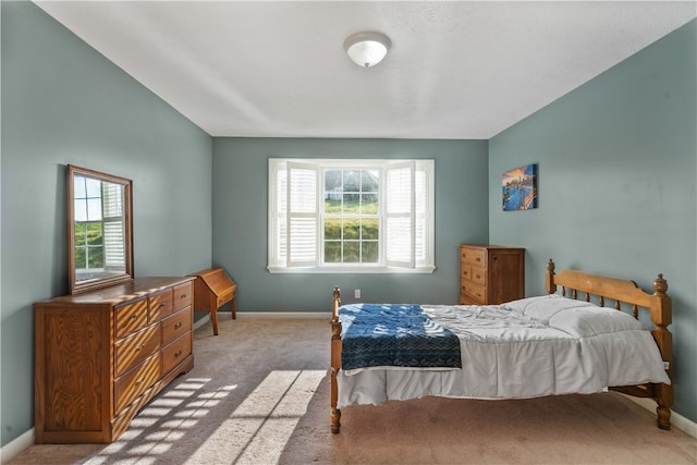 bedroom featuring light colored carpet