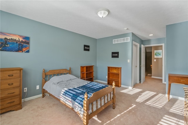 bedroom featuring light carpet