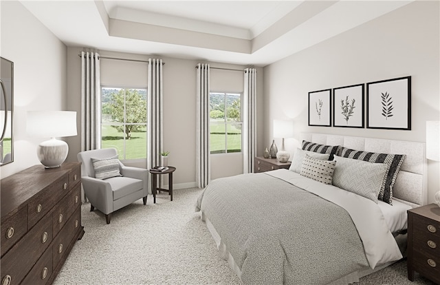 carpeted bedroom featuring a tray ceiling and multiple windows