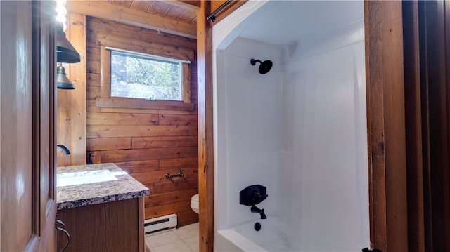 full bathroom featuring a baseboard heating unit, wood walls, vanity, and bathtub / shower combination