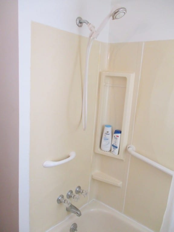 bathroom with shower / bath combination with curtain