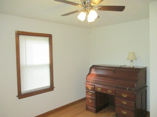 office featuring light wood-type flooring and ceiling fan