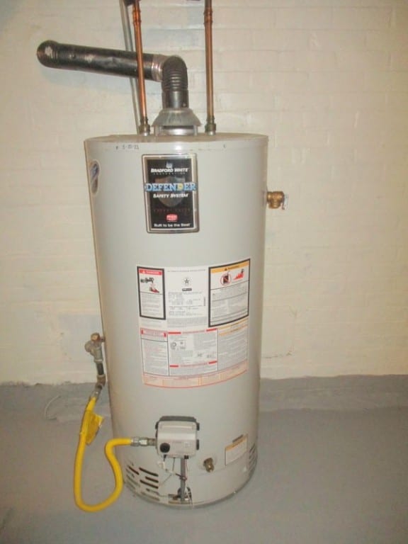 utility room featuring gas water heater