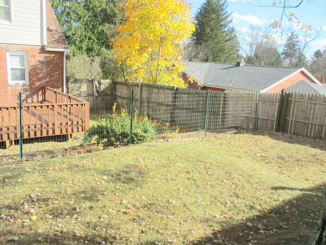 view of yard with a wooden deck