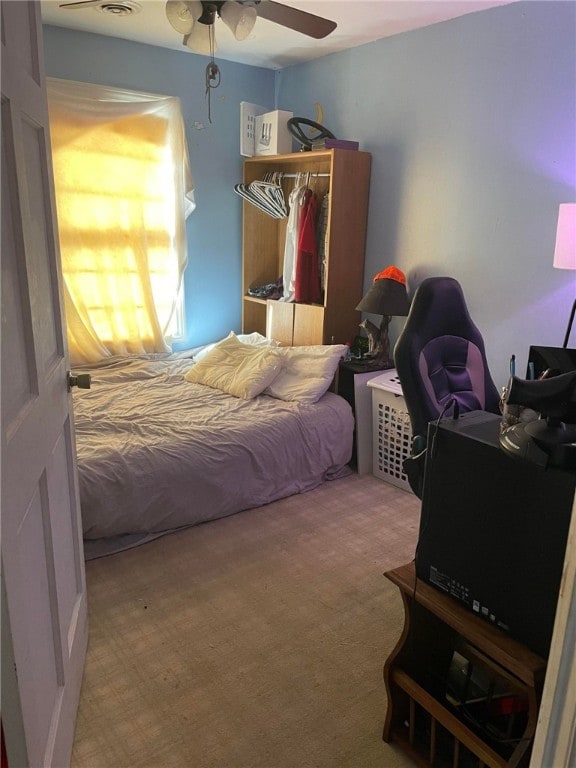 carpeted bedroom with ceiling fan