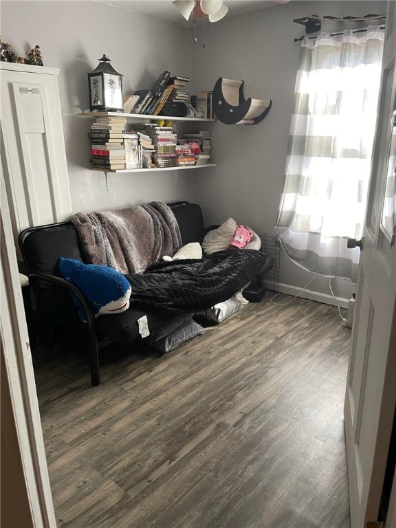 sitting room with a wealth of natural light, hardwood / wood-style flooring, and ceiling fan