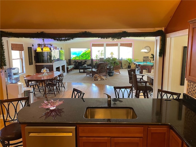 kitchen with pool table, lofted ceiling, sink, and a healthy amount of sunlight