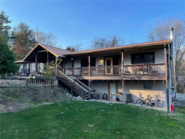 4199 Morgantown Rd, Springhill Twp, PA 15478 - rear view of property featuring a yard and stairs