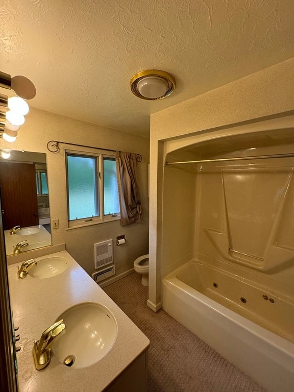 full bathroom with vanity, a textured ceiling, shower / tub combination, a wall mounted air conditioner, and toilet