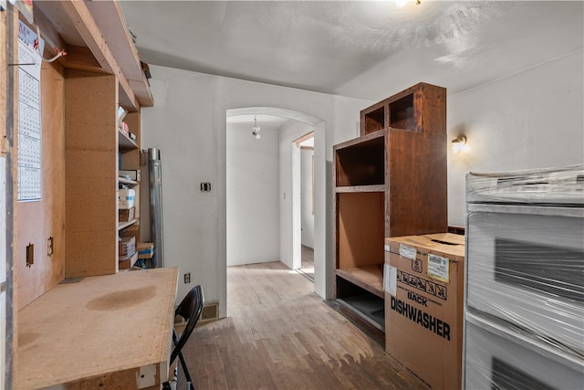 bathroom with hardwood / wood-style flooring