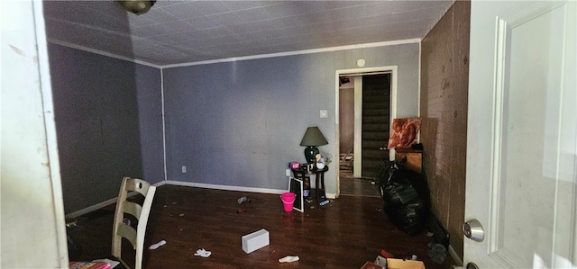 interior space featuring dark hardwood / wood-style flooring and ornamental molding