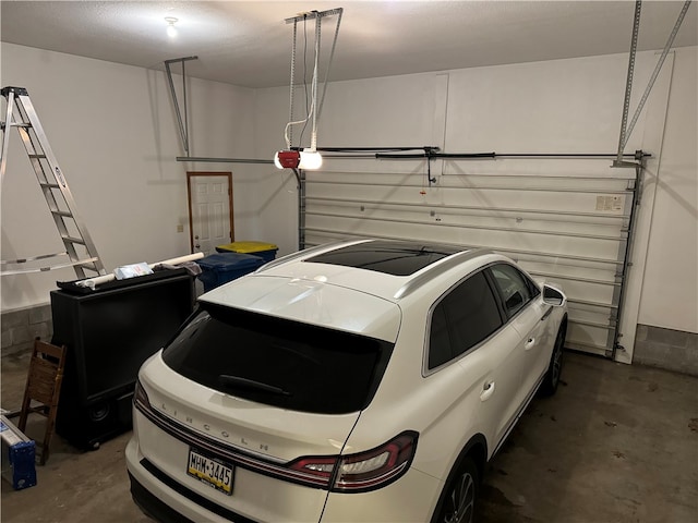 garage featuring a garage door opener