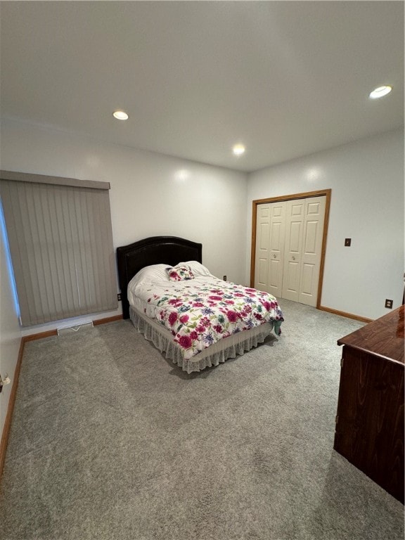 bedroom featuring a closet and carpet floors