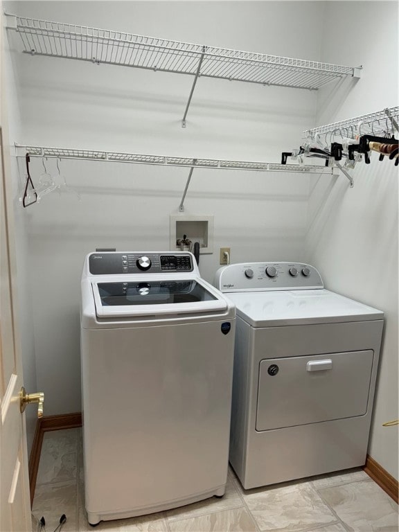 washroom with washing machine and dryer