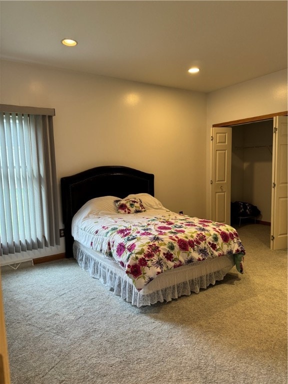 carpeted bedroom featuring a closet